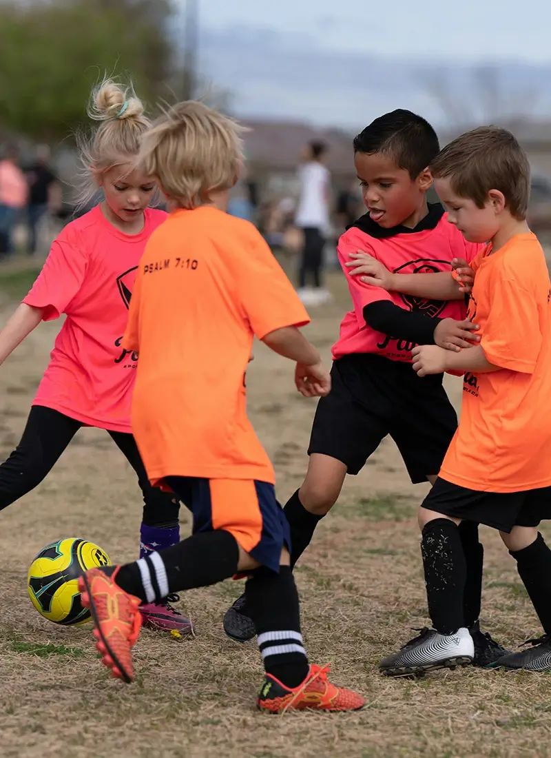 Child's Next Adventure Kids playing soccer