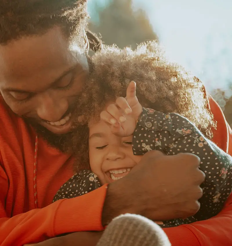 Smiling dad and daughter