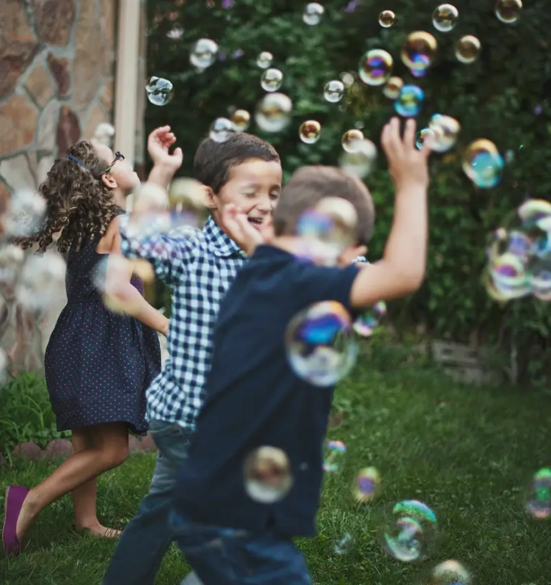 Children playing with bubbles