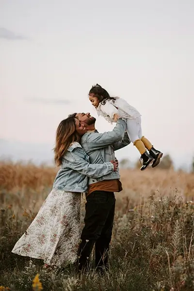 Supporting Healthy Families Parents smiling with daughter